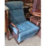 A mid-century stained wood armchair with blue upholstered button down back and loose cushion, on