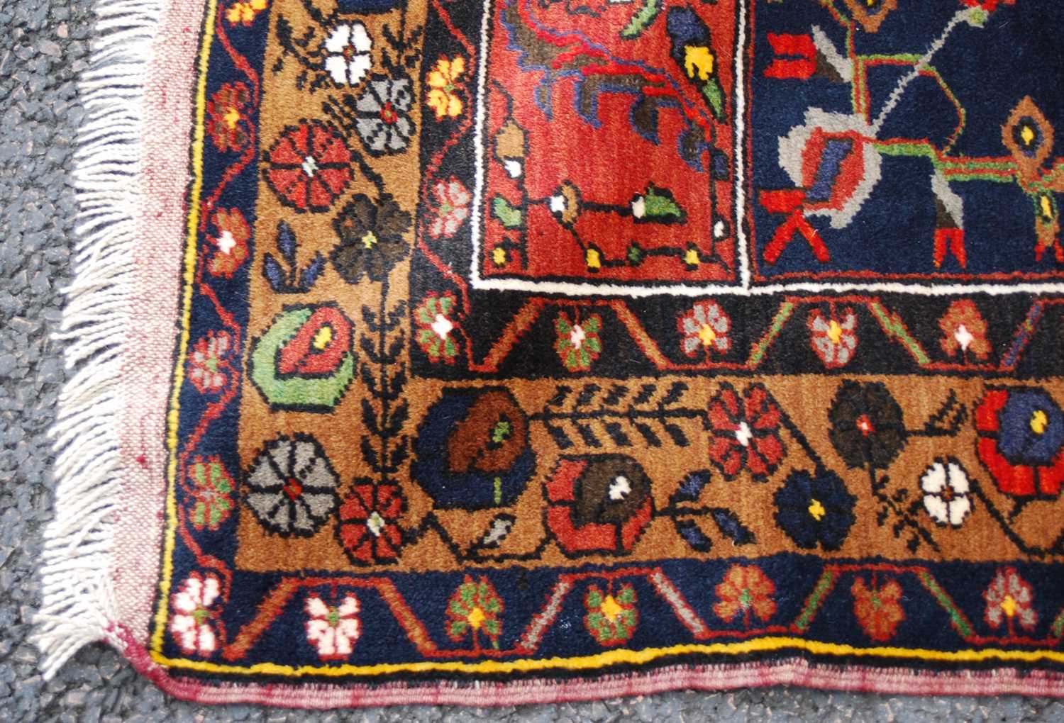 A Turkish long rug, 20th century, the rectangular abrashed madder ground centred with a large oval - Image 4 of 6