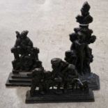 Three assorted antique black-painted cast metal doorstops, one in the form of a soldier, another