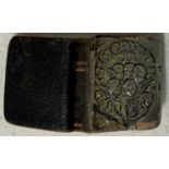 A Birmingham silver mounted book of common prayer, the silver cover embossed with cherubs