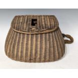 Fishing interest- An antique wicker fishing creel, 24cm high.