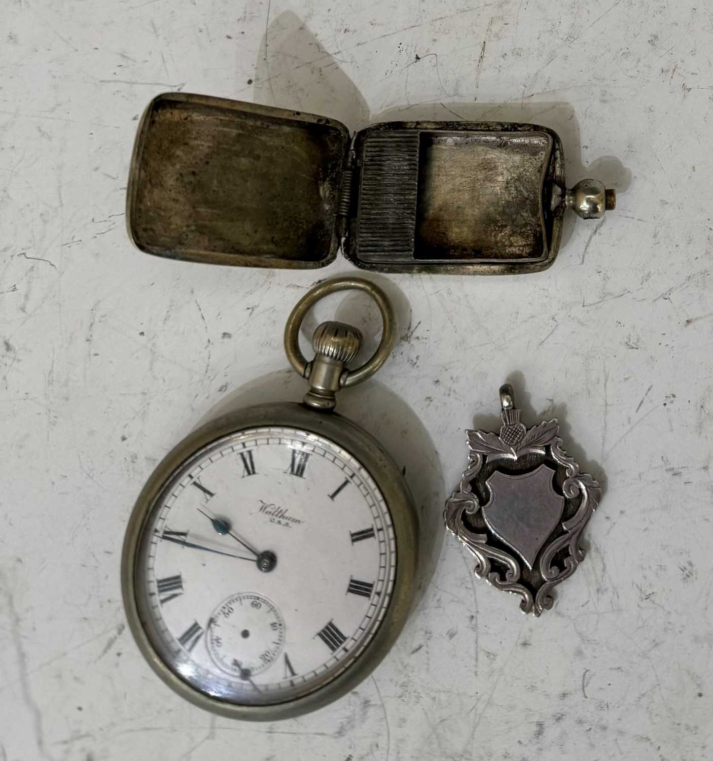 A vintage Waltham USA white metal cased open faced pocket watch and electroplated rectangular