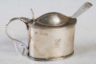 An Edwardian silver mustard pot, London, 1900, oval shaped with hinge cover and blue glass liner and