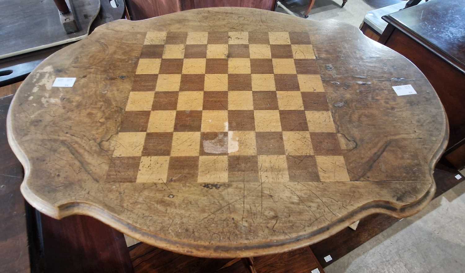 A 19th century walnut and parquetry inlaid pedestal games table, the shaped oval top centred with - Image 2 of 2