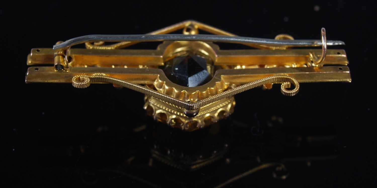 A yellow metal and citrine set bar brooch, stamped '9CT', 52.5 mm wide, gross weight 6 grams. - Image 2 of 2