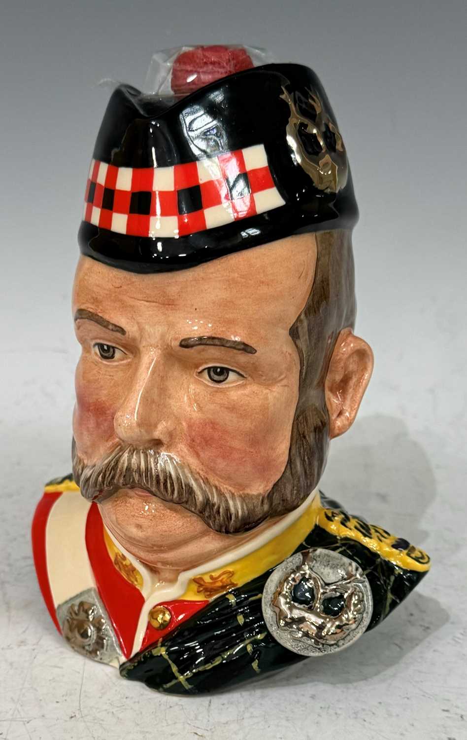 Whisky interest - A Royal Doulton character jug in the form of a Highlander, specially