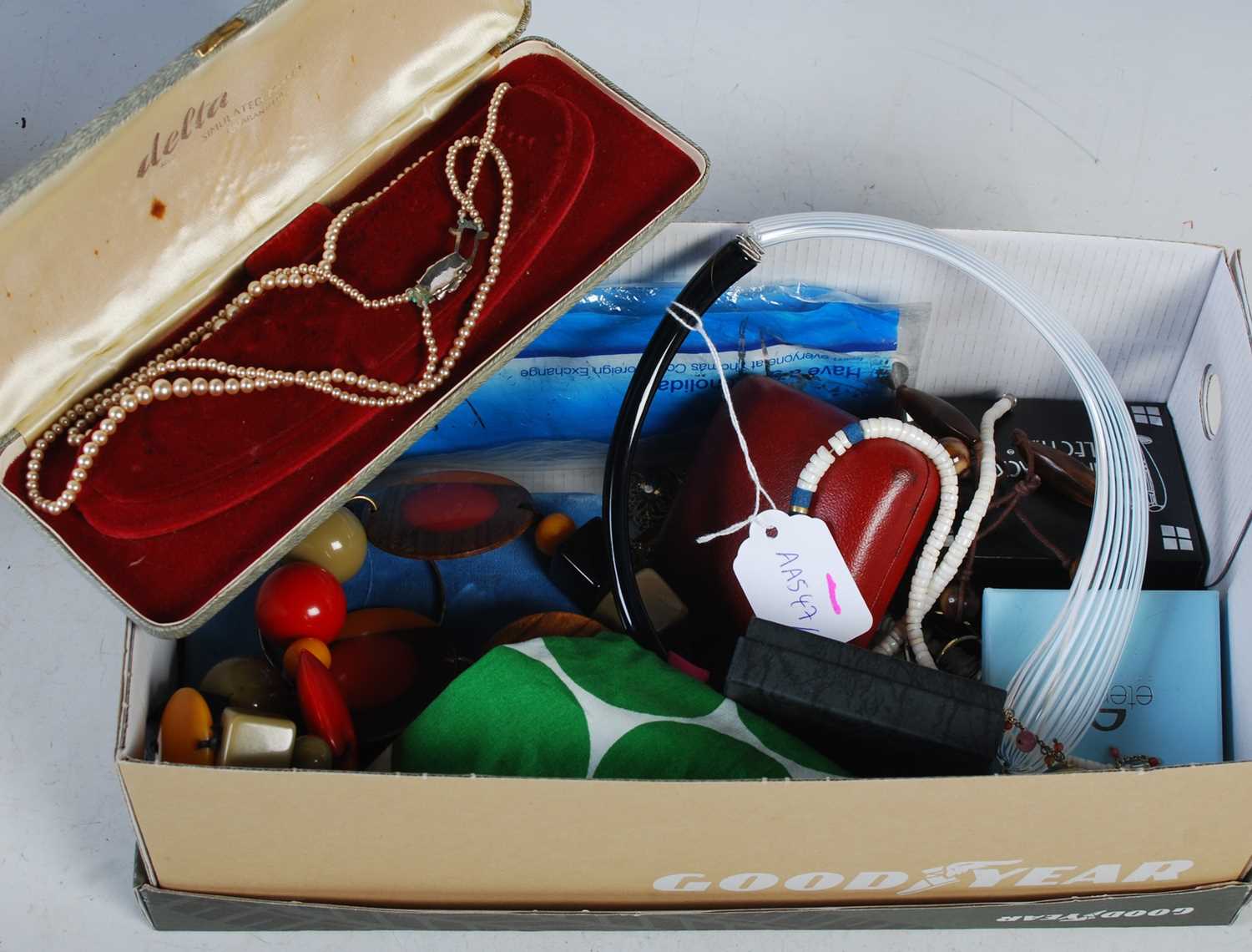 A box of assorted costume jewellery.