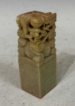 A Chinese soapstone seal with carving of a Dragon, the underside with two Chinese character marks