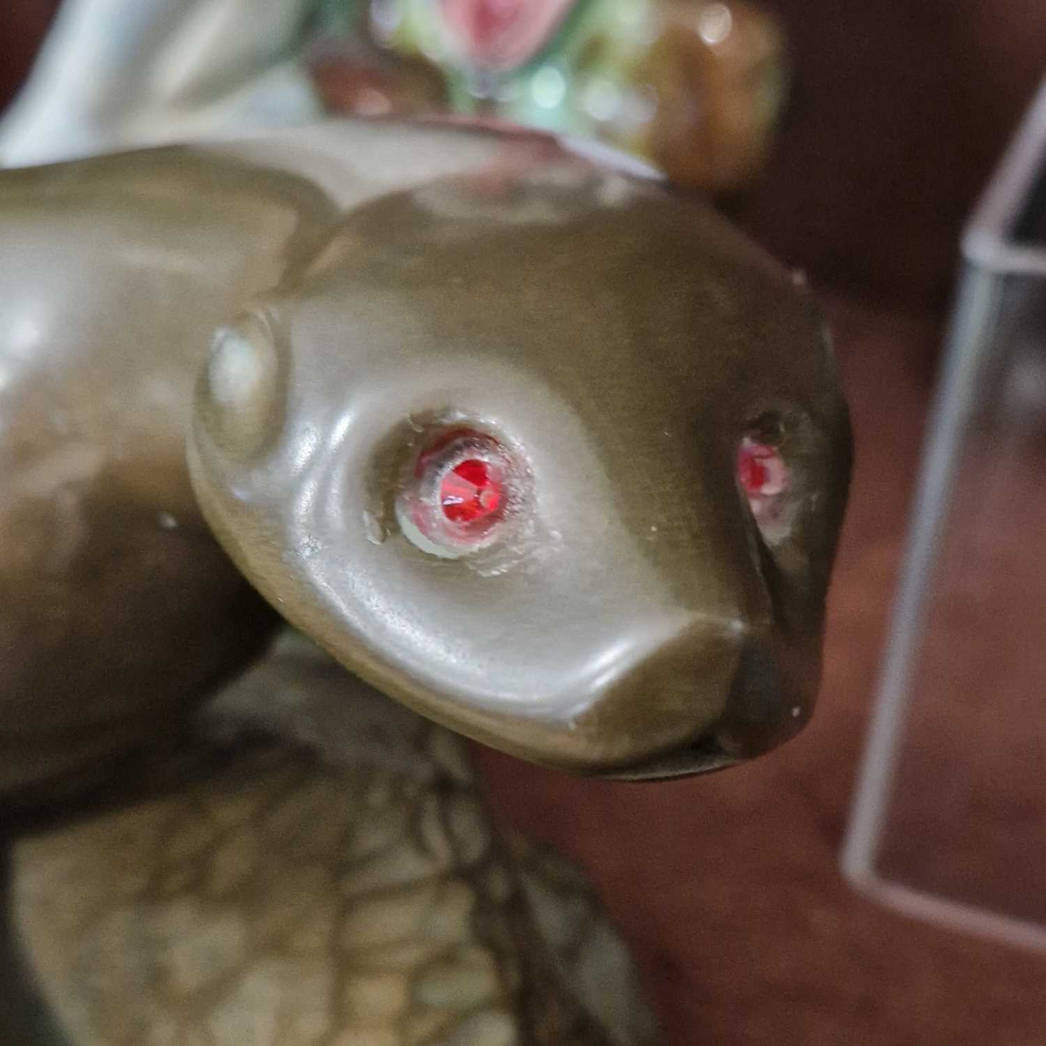 An Art Deco style bronzed composite figure of an otter with red facet cut inlaid glass eyes, - Image 2 of 2