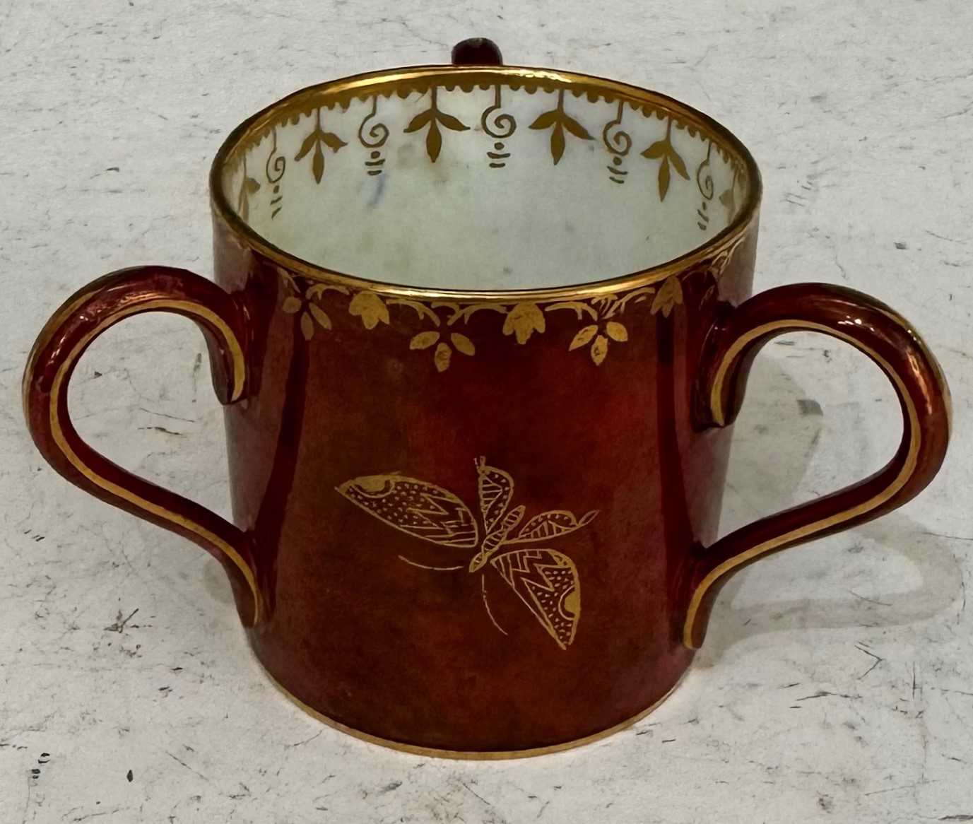 An early 20th century Wedgewood butterfly lustre tyg, the underside with painted marks 'Z4827 / X'