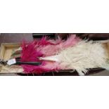 Two vintage feather fans, the first with Mother of Pearl sticks and white ostrich feathers, 46cm