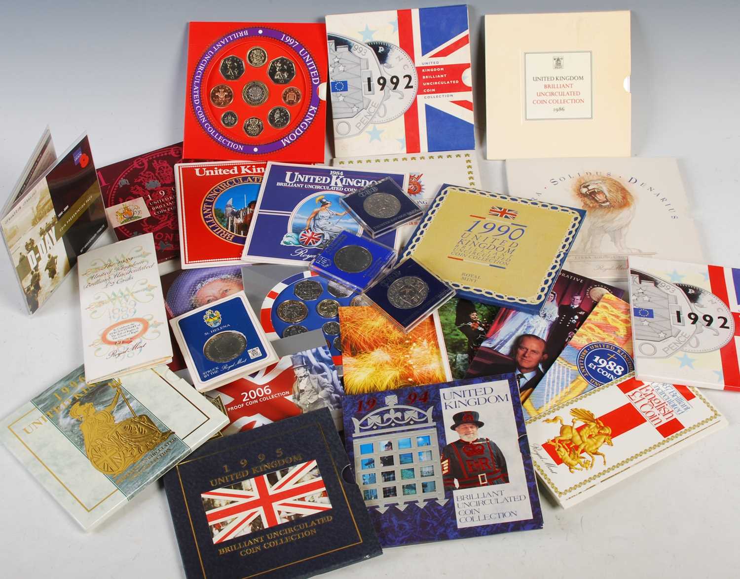 A collection of assorted Royal Mint uncirculated coin collections.