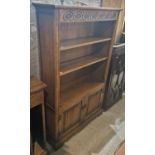 Three pieces of Wood Bros Furniture Ltd, comprising a Hatfield bookcase, 153cm high; a CD storage