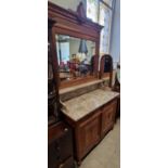 A Continental oak Art Deco style mirror-back marble top sideboard, 110cm wide x 223cm high.