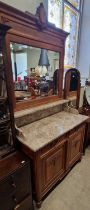 A Continental oak Art Deco style mirror-back marble top sideboard, 110cm wide x 223cm high.