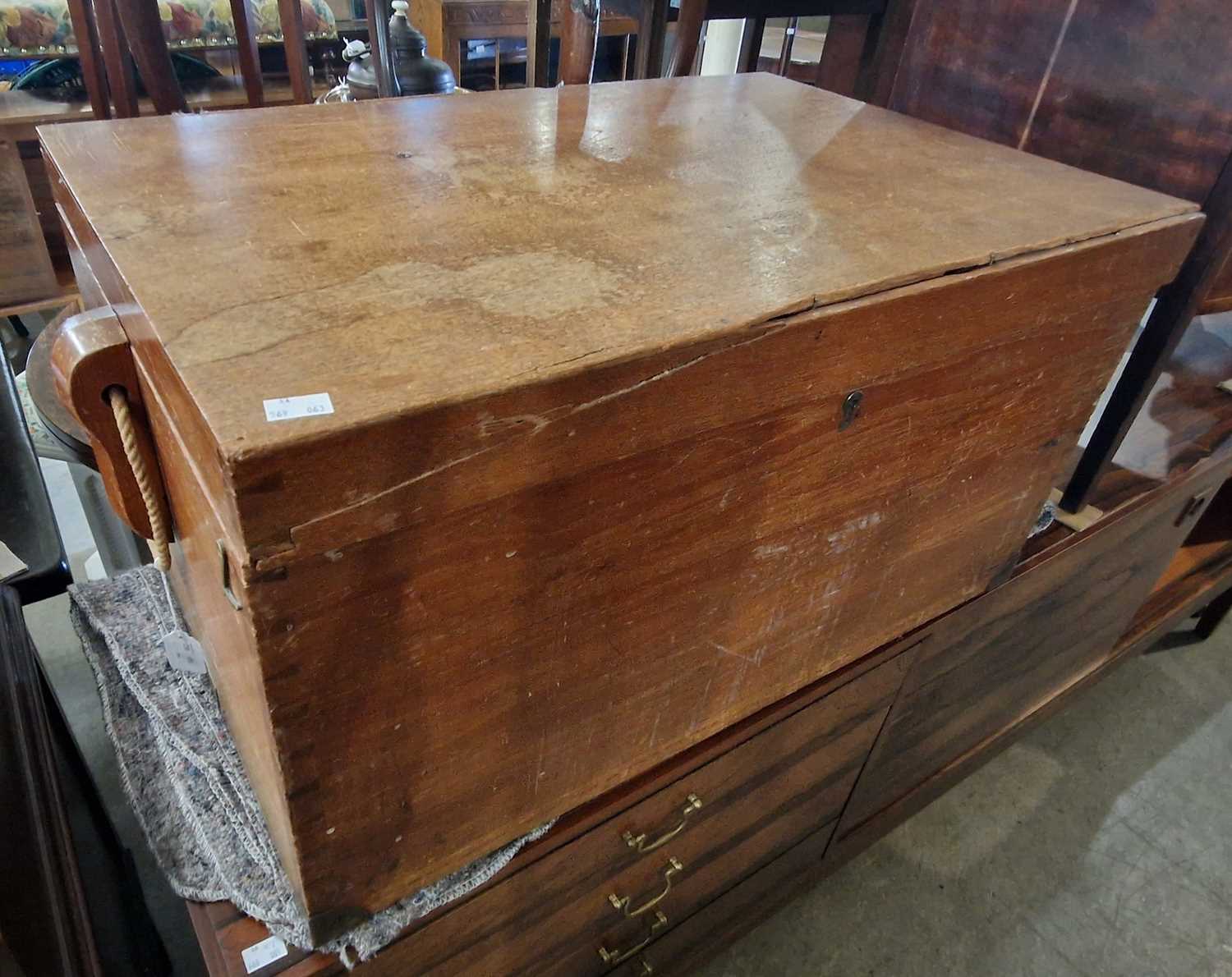 A teak rectangular storage box with rope twist handles, 76cm wide.