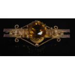 A yellow metal and citrine set bar brooch, stamped '9CT', 52.5 mm wide, gross weight 6 grams.