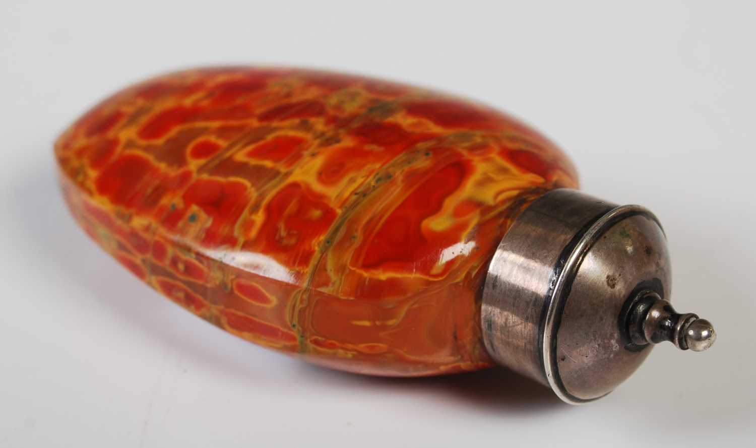 A Chinese white metal mounted glass snuff bottle imitating Realgar, 7.5 cm high. - Image 2 of 2