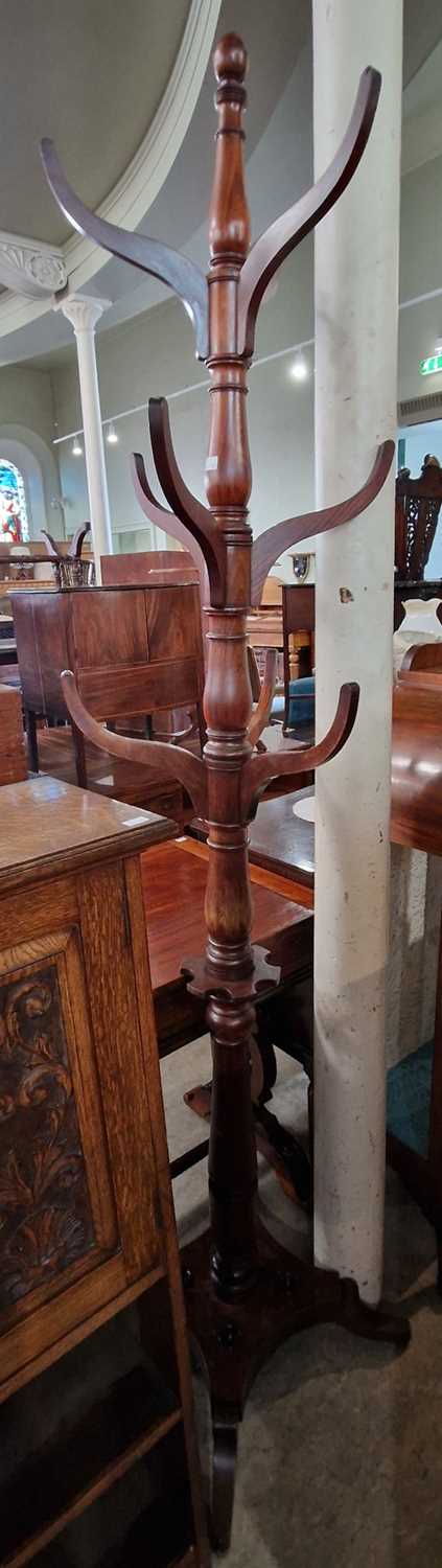A 19th century mahogany hat, coat and stick stand, the turned central column with nine concave