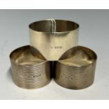 Three assorted Birmingham silver napkin rings, gross weight 2.25 troy ozs.