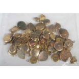 A large collection of assorted yellow metal and rolled gold heart-shaped and oval-shaped lockets,