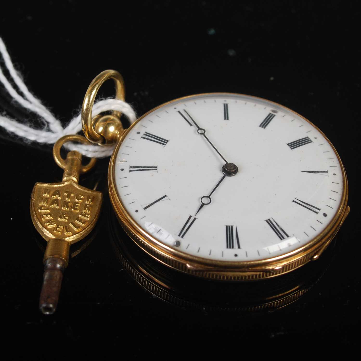 A 19th century yellow metal open faced pocket watch, the black and white dial with Roman numerals,