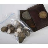 A brown leather purse containing assorted 19th century and later coinage, two bags of early 20th