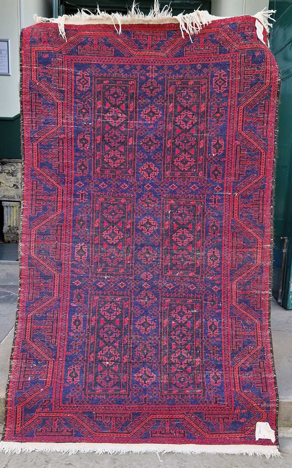 A Persian rug, mid 20th century, the rectangular blue ground decorated with six rectangular shaped - Bild 2 aus 4