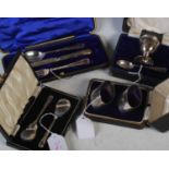 Four cased sets of assorted silver to include, egg cup and spoon set, fork, knife and spoon set,