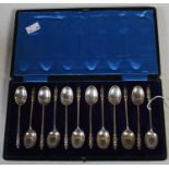 A cased set of twelve Edwardian silver apostle type teaspoons, Sheffield, 1903.