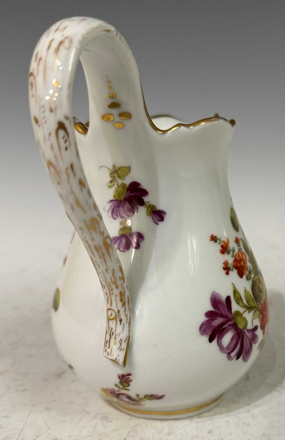 A mid-19th century Meissen style cream jug, with hand painted floral details and gilded accents, - Image 3 of 3