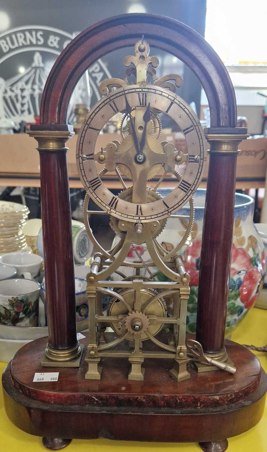 A 19th century mahogany and brass skeleton clock, the silvered chapter ring with Roman numerals,