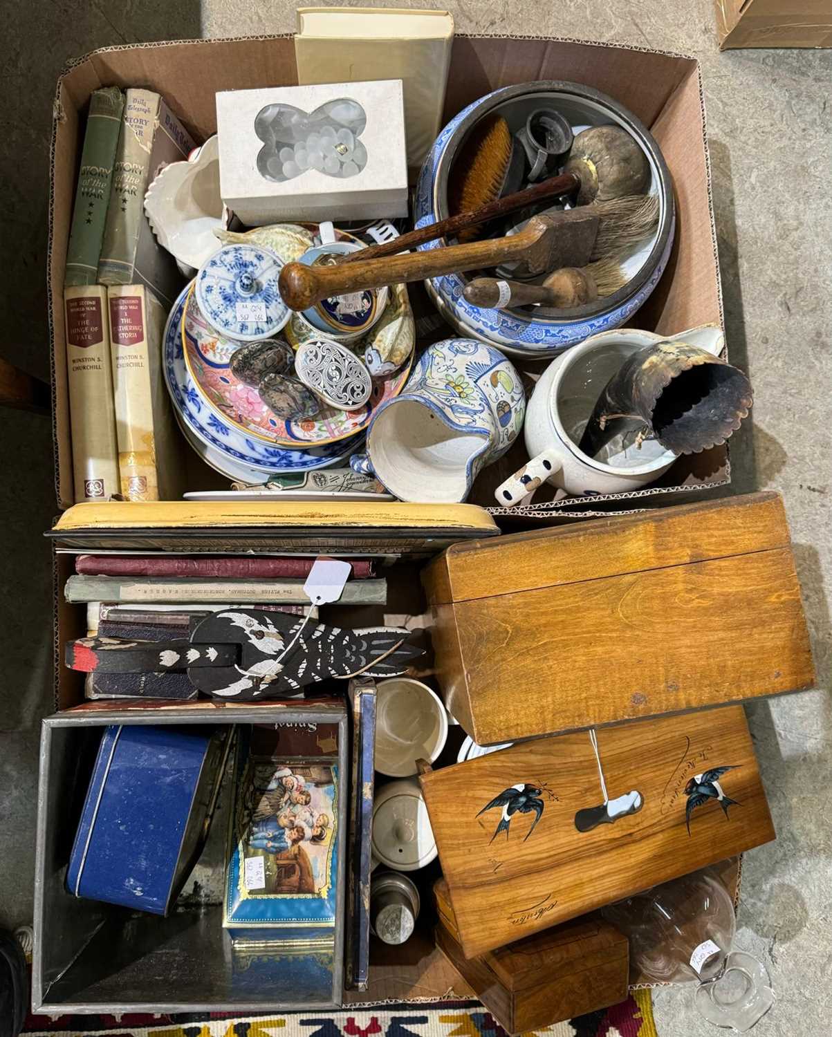 Two boxes of assorted mixed wares to include advertising tins, ear horn, ceramics, books etc.