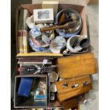 Two boxes of assorted mixed wares to include advertising tins, ear horn, ceramics, books etc.