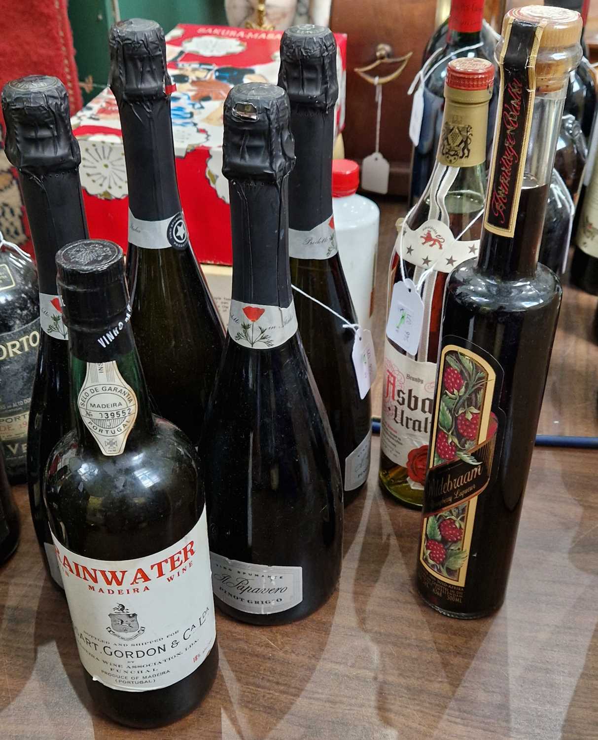 Seven bottles; Four Pino Grigio Vino Spumante Brut, 750ml, one Asbach Uralt Brandy 24 1/2 fl.oz, one