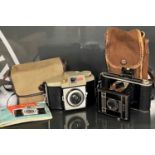 Two vintage cameras comprising an 'AGFA JGE F:8.b Billy-Clack' camera in carry case, and a 'Kodak