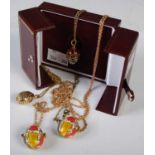 Sarah Faberge - A gilt metal, enamel and paste set egg-shaped pendant and chain, together with a
