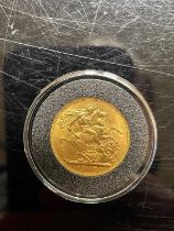 An Edward VII gold sovereign dated 1907.