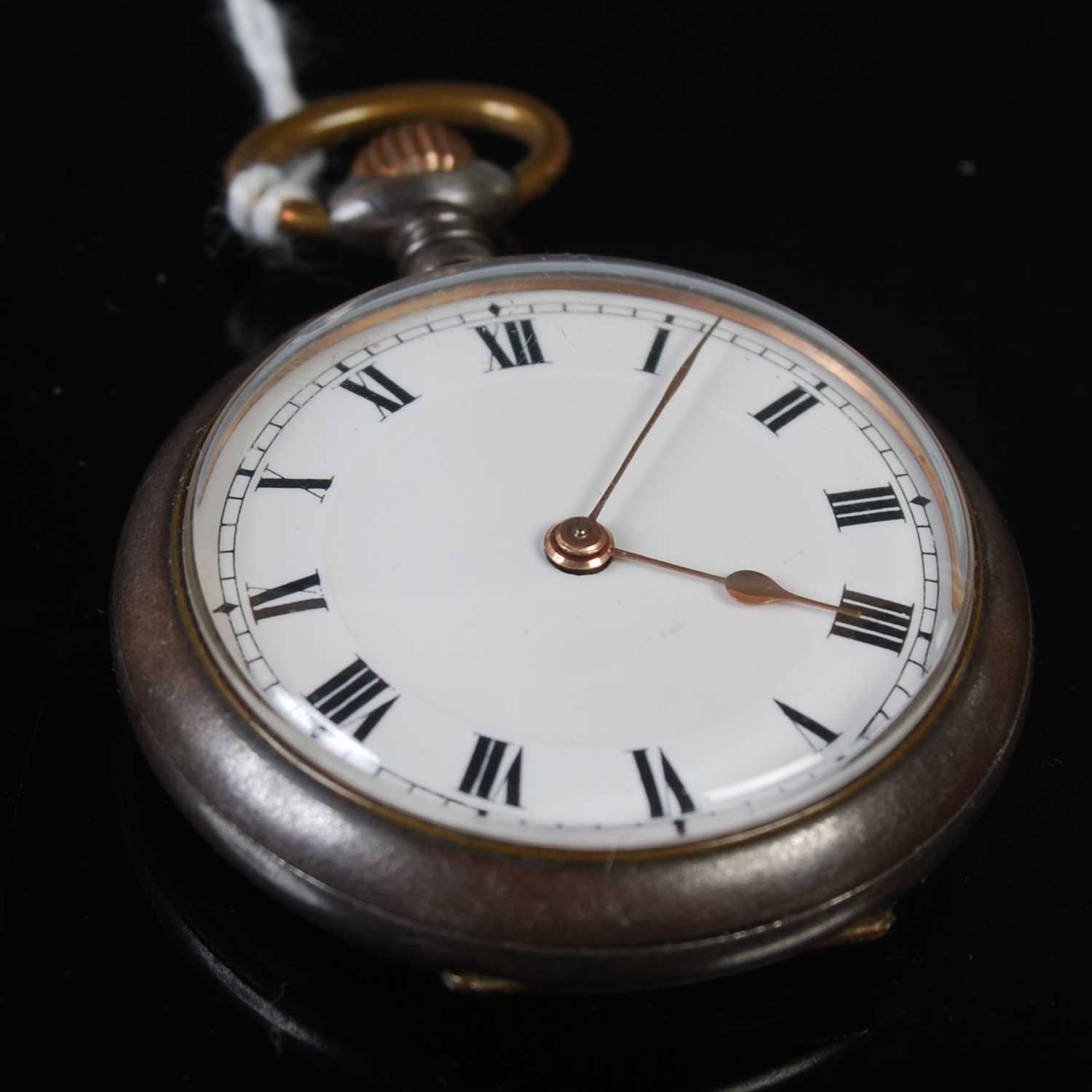 A vintage gun-metal open faced pocketwatch, the black and white dial with Roman numerals, 34.5mm