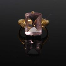 A late 19th century yellow metal and pale amethyst single stone ring stamped 18C, ring size J.