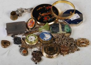 A collection of assorted costume jewellery to include brooches, powder compacts, chains etc.