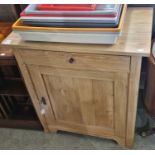 A pine side cabinet fitted with single drawer and cupboard door below, 81cm wide x 91cm high.