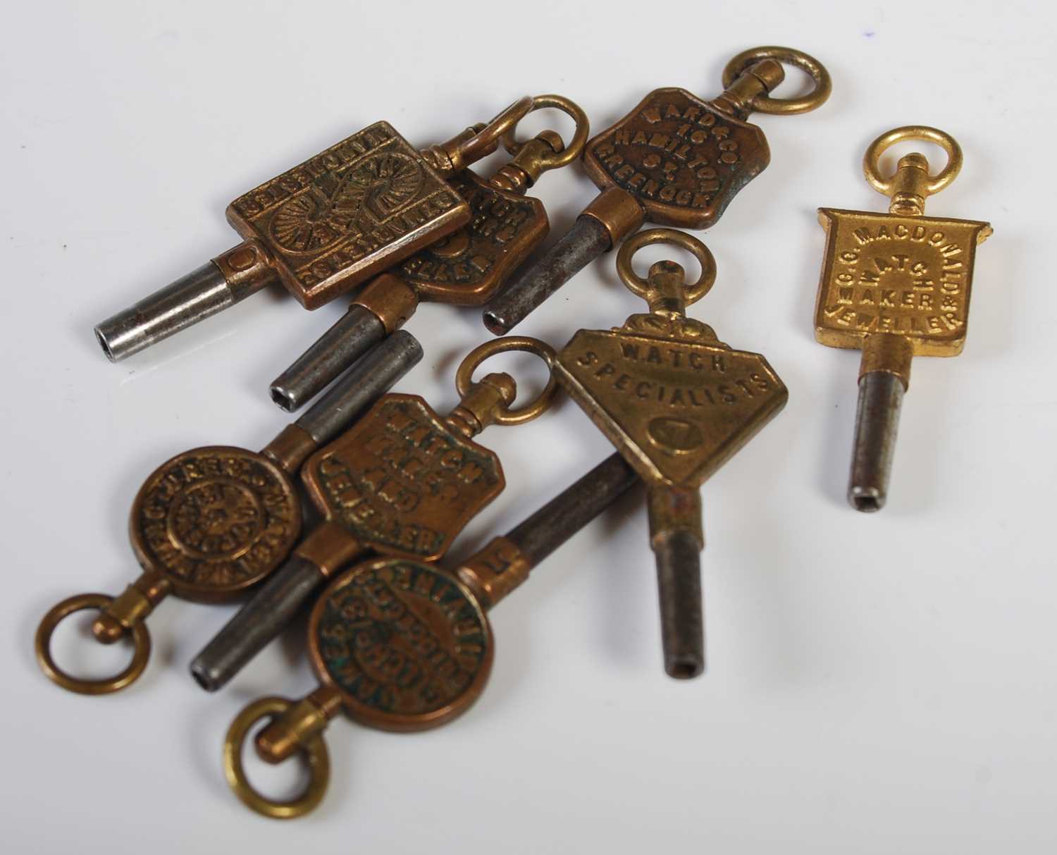 Eight assorted antique pocket watch keys.