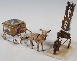 A Palais Royale style casket of cube form, mounted on a sleigh being pulled by a reindeer together