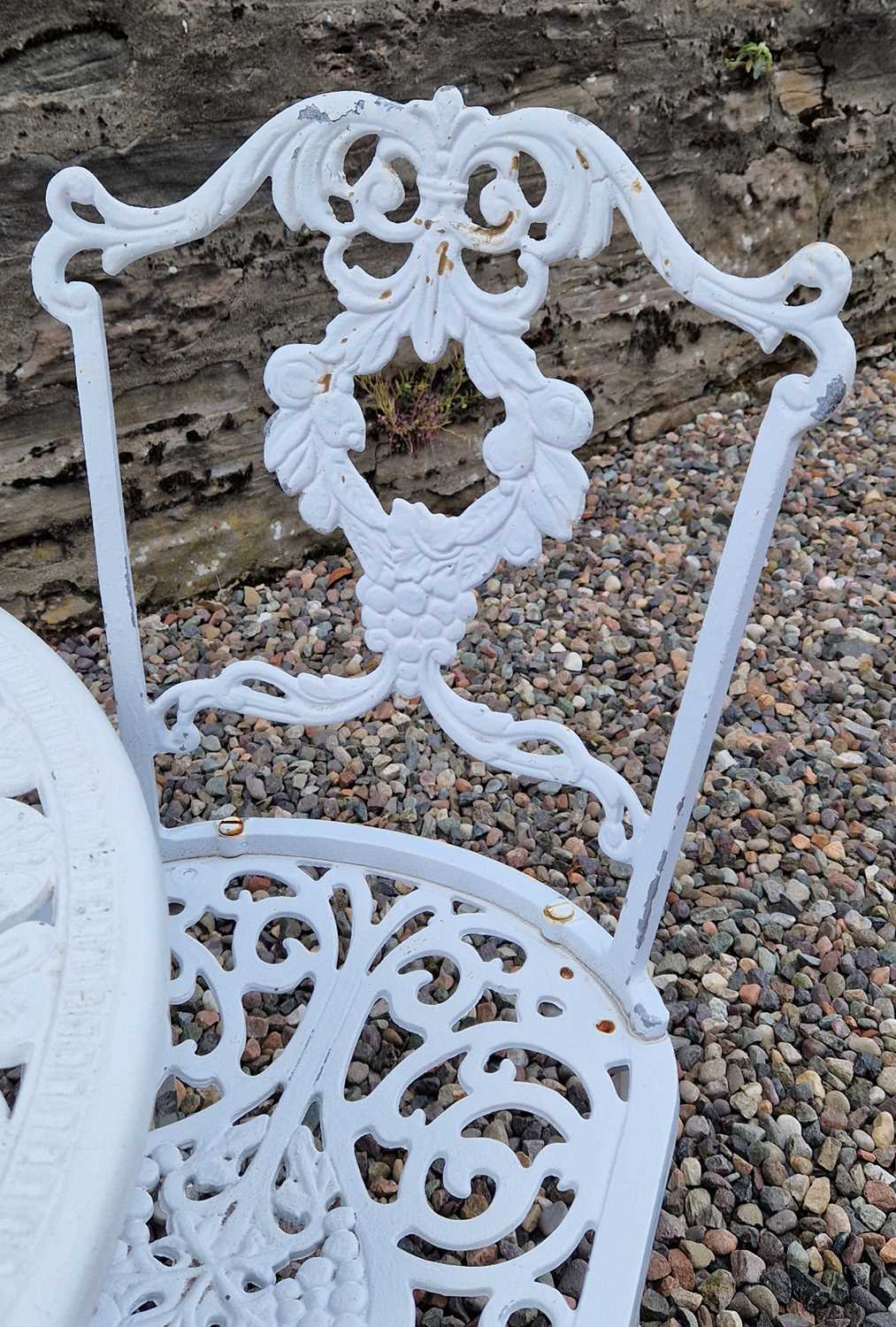 A white-painted cast metal garden table and three chairs, the table 81cm diameter. - Image 3 of 5