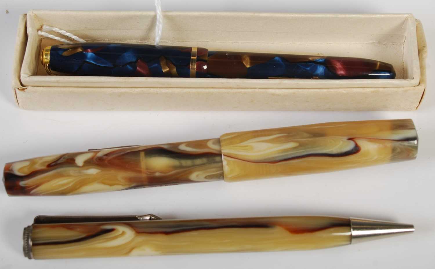 A vintage Conway Stewart 'Dinkie 550' fountain pen, with 14CT gold nib in purple, blue and brown