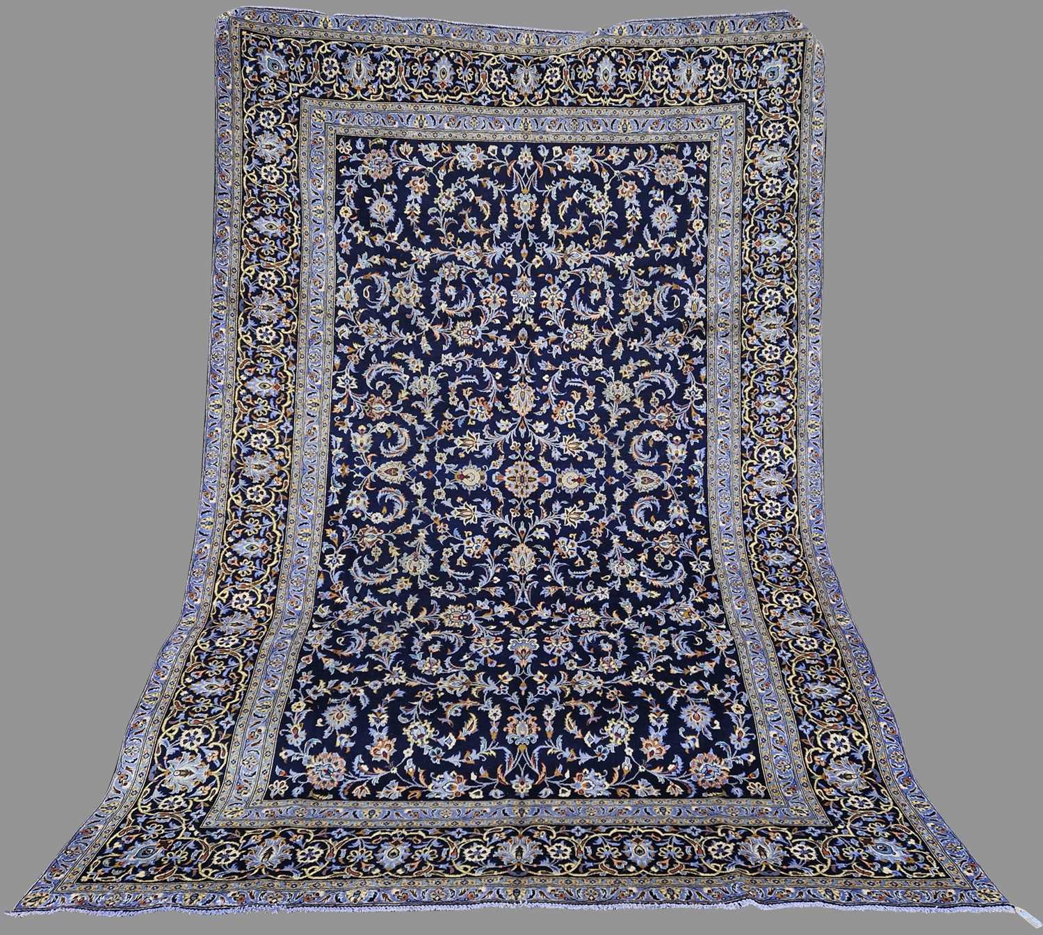 A Persian Isfahan carpet, 20th century, the rectangular blue ground field decorated with all-over