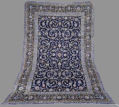 A Persian Isfahan carpet, 20th century, the rectangular blue ground field decorated with all-over