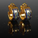 A pair of yellow metal and enamel decorated clip earrings by Michaela Frey, Wien, gross weight 11.