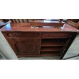 A 20th century stained oak side cabinet fitted with two frieze drawers over a cupboard door and